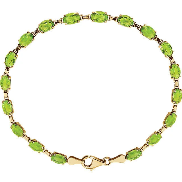 silver bracelet with angel wings for guidance and protection-14K Yellow Gold Oval Peridot 7.25" Line Tennis Bracelet